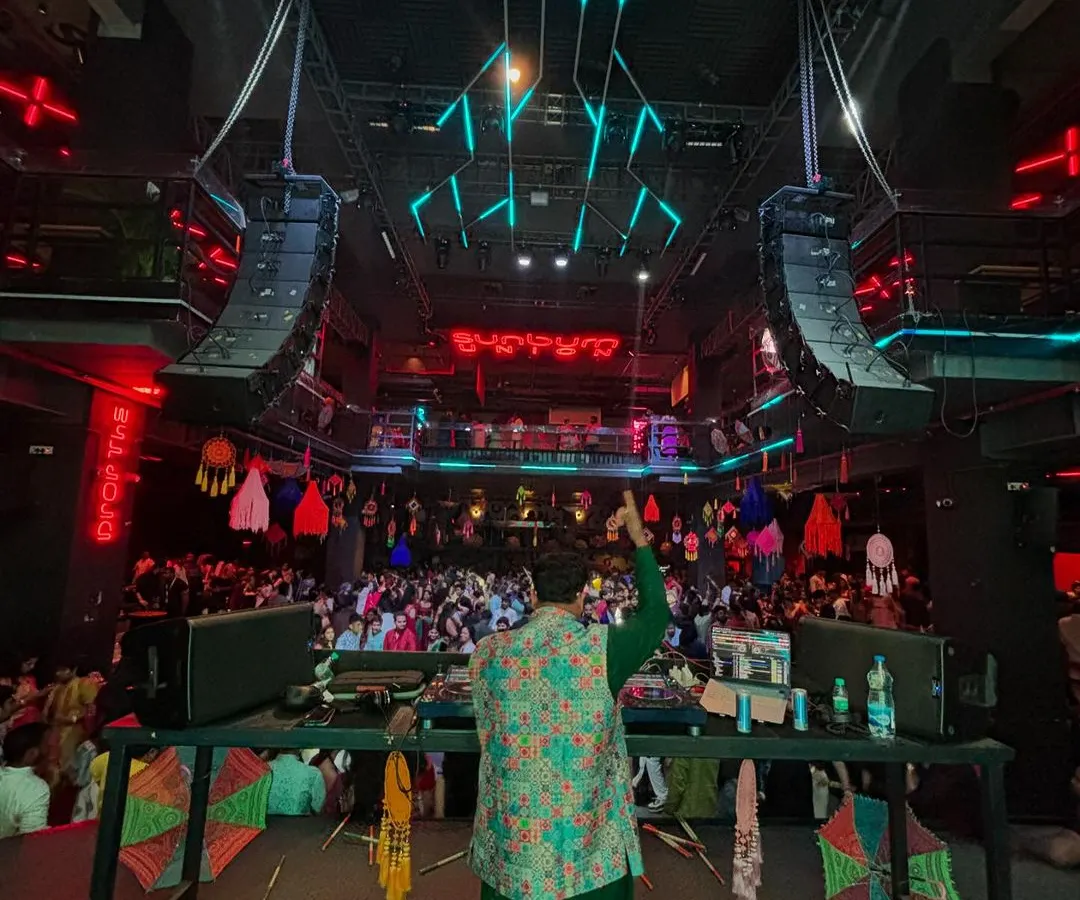 A view from my console during a massive Navratri Garba night. Seeing a crowd this size, completely lost in the music and dancing together, is what it's all about. I specialize in managing the energy for large-scale cultural events and festivals.