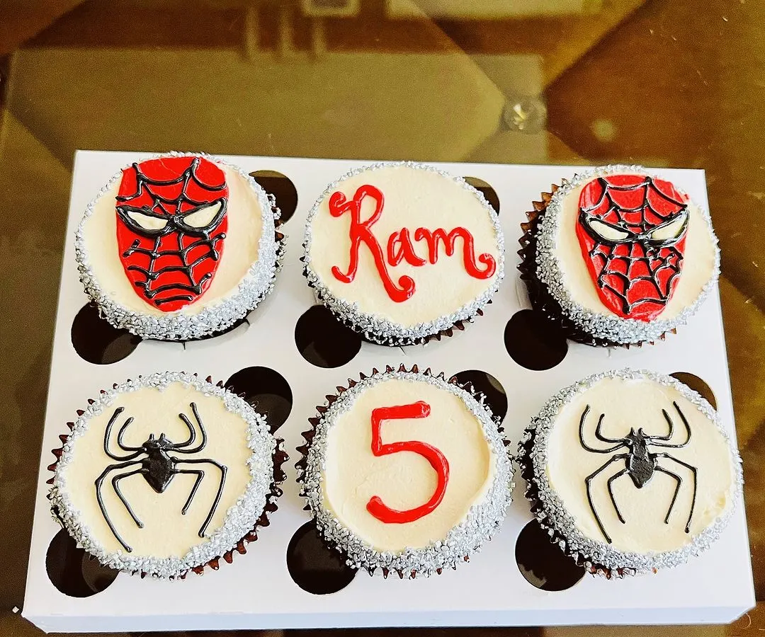 We love bringing your favorite characters to life. This custom Spider-Man themed cupcake box was for Ram's 5th birthday. It includes detailed Spider-Man masks, the iconic spider logo, and personalized touches with his name and age, all handcrafted with buttercream.