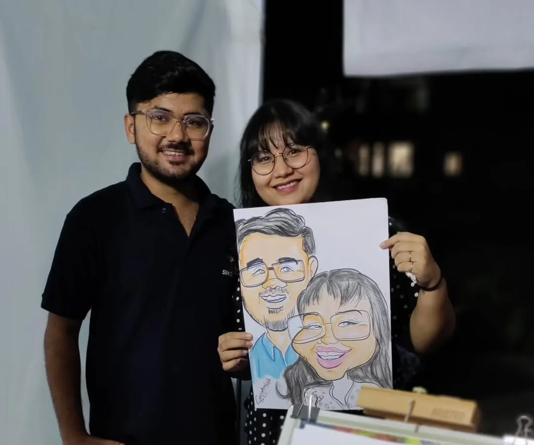 A perfect keepsake for a lovely couple. I enjoy drawing couples and capturing their connection in a fun, cartoon style. This one was done live at a night carnival, and their smiles say it all.