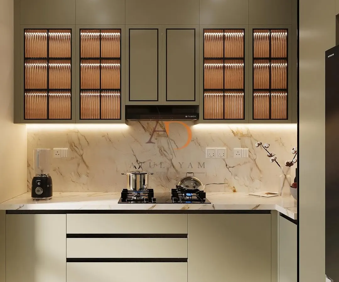 A kitchen is the heart of the home, and I design them to be both beautiful and highly functional. This modular kitchen features sleek, dual-tone cabinetry with fluted glass, under-cabinet lighting for ambiance, and a stunning marble backsplash, proving that practicality can be elegant.