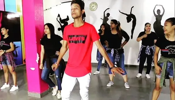 Leading a group of enthusiastic dancers during a wedding choreography practice session. My goal is to make everyone comfortable on the dance floor, whether you are a beginner or have danced before. We create memorable performances together.