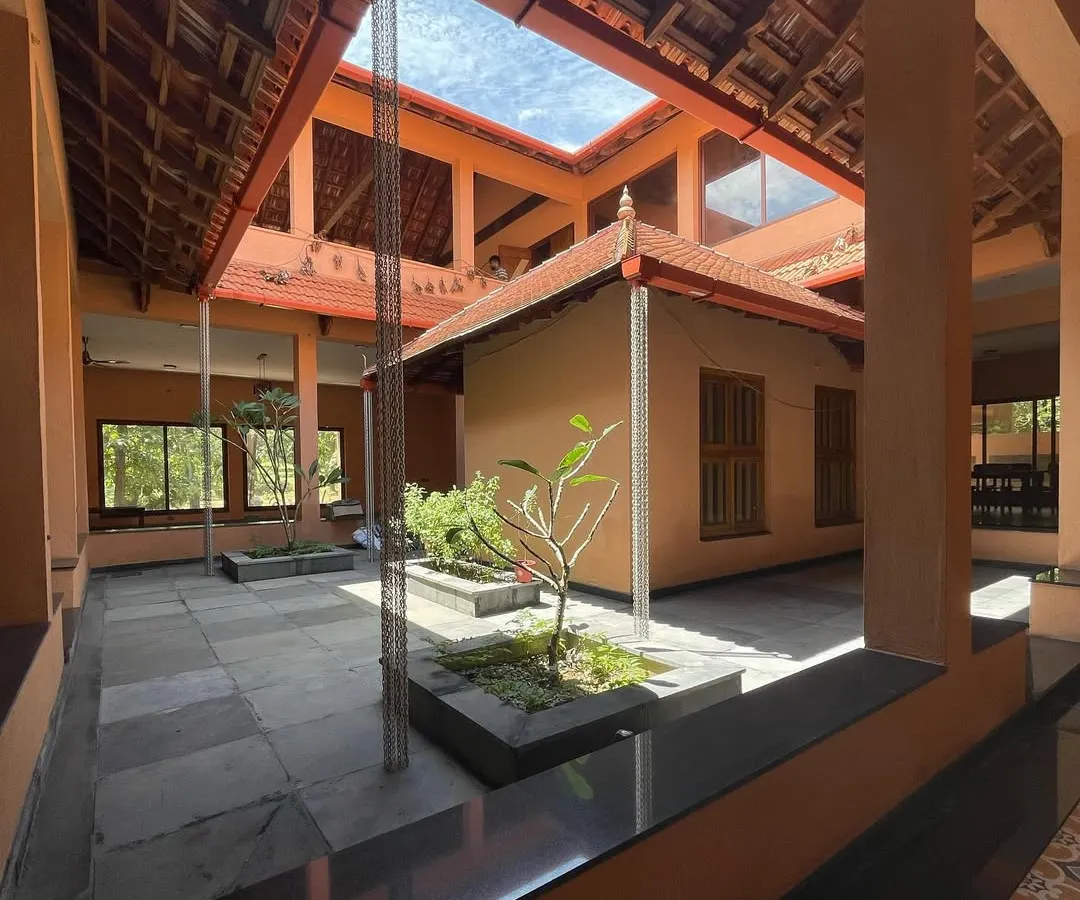 At the heart of the 'SHANTHA-KAMALA' residence is this open-to-sky courtyard, a core element of traditional Karnataka architecture that brings light, air, and nature into the home.
