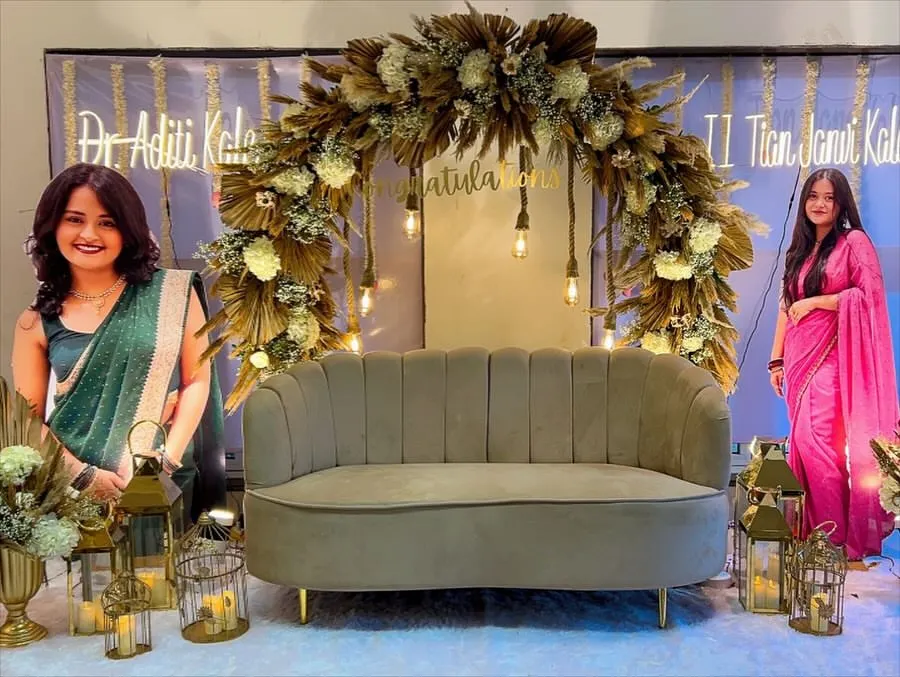 We were so honored to celebrate two brilliant sisters with this custom boho-chic decor. The setup features a lush arch of dried pampas grass and white florals, warm Edison bulb lighting, and elegant lanterns to create a sophisticated and celebratory atmosphere.