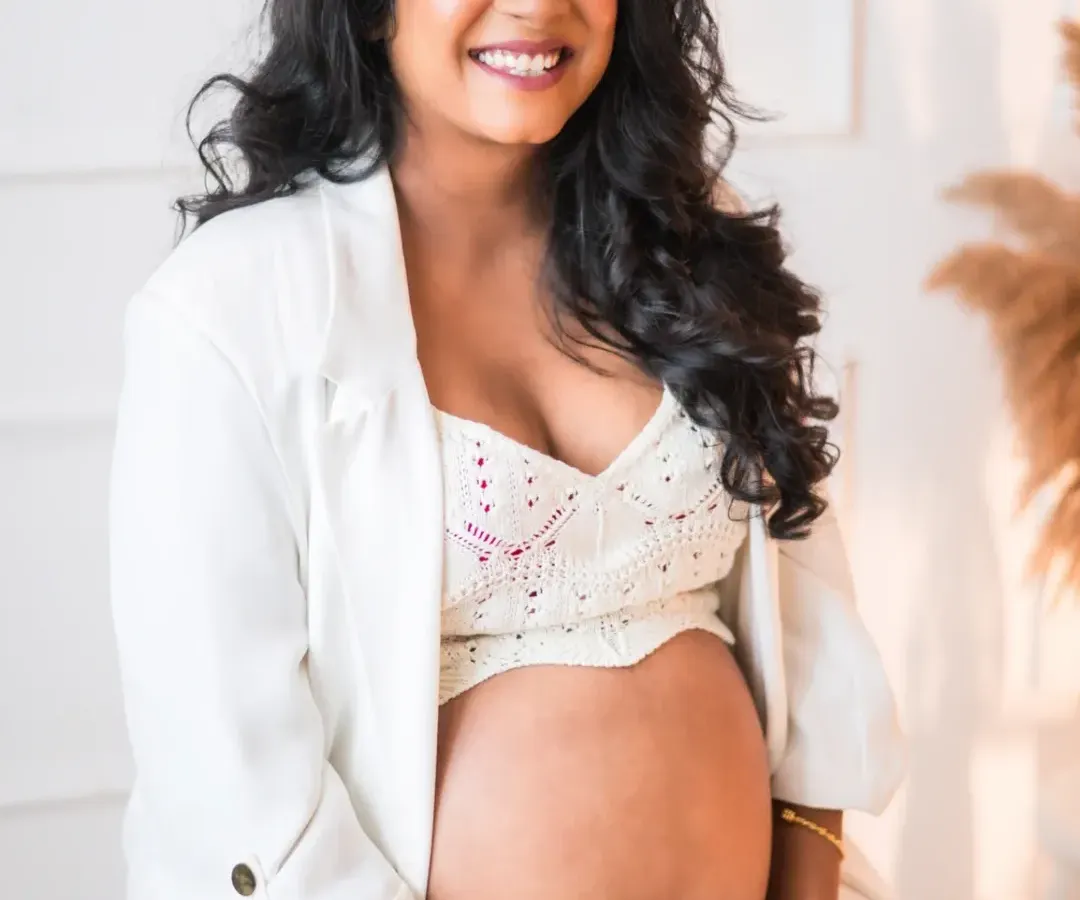 The radiant glow of a mother-to-be. I love capturing the quiet strength and beauty of pregnancy. This portrait, with its clean, modern feel, focuses on the beautiful bond between a mother and her unborn child, a simple and powerful moment of anticipation.