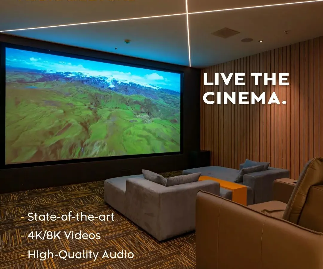 We believe in creating spaces where you can truly live the cinema. This modern media room features a massive 4K screen, plush, comfortable seating, and integrated ceiling lights, all designed to deliver a state-of-the-art, high-quality audio and video experience.