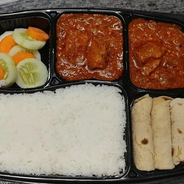 We offer a wide variety of non-vegetarian meals, prepared with the same care as our veg options. This thali features flavorful chicken curries, soft rotis, steamed rice, and a side of fresh salad, perfect for a hearty meal subscription.