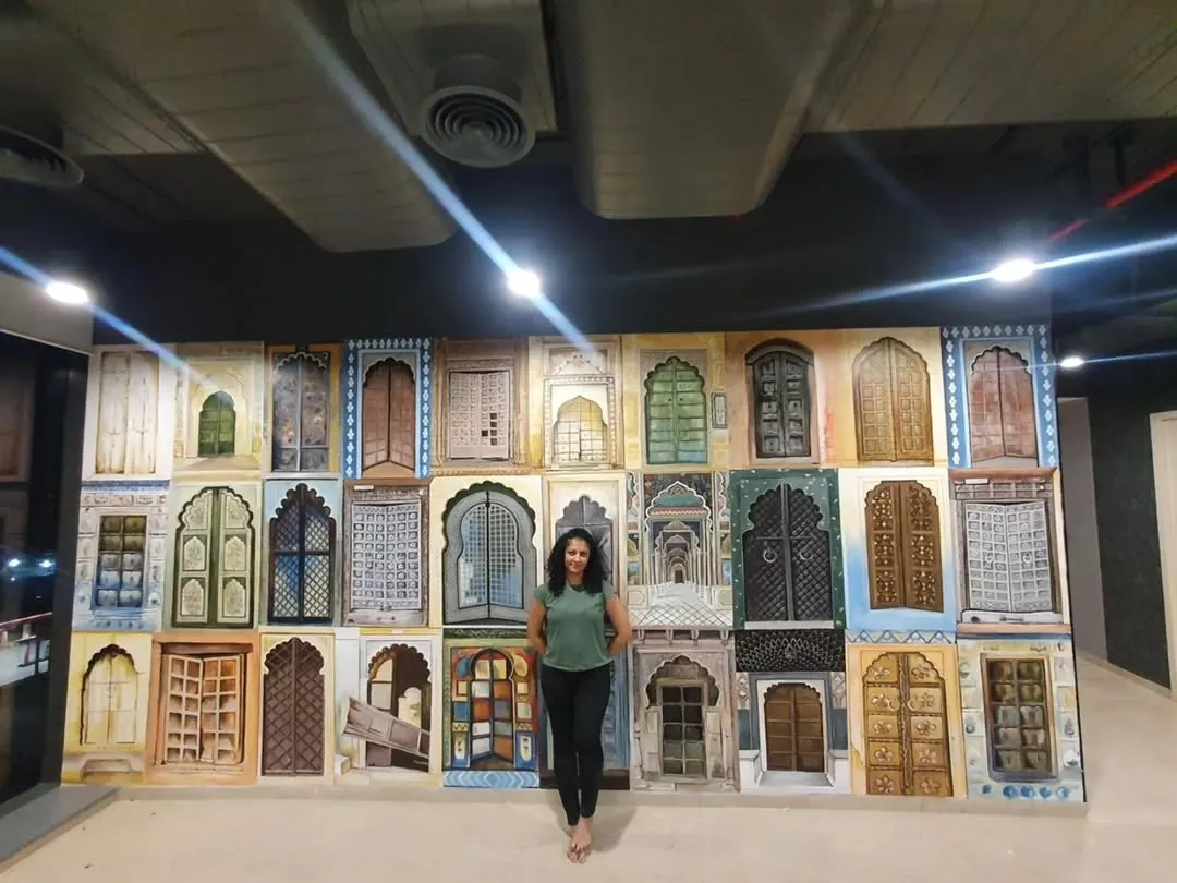 I love bringing cultural stories to life, like in this 'Doors of India' mural for Tablespace in Hyderabad. Each door is hand-painted with intricate details, representing the diverse architectural styles across the country. It’s a large-scale piece that serves as a constant source of discovery and conversation.