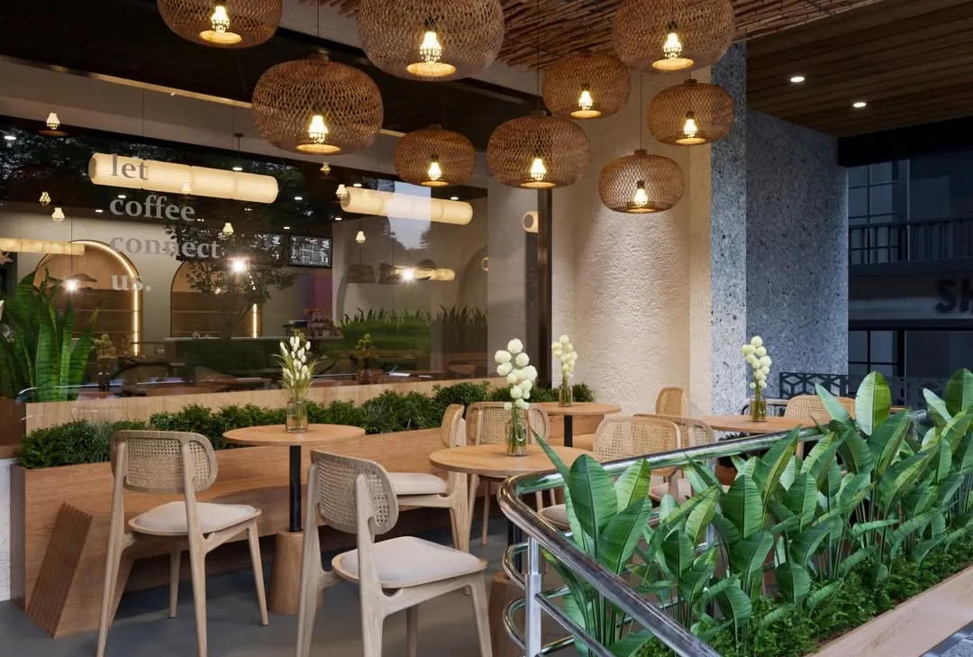 Stepping into the semi-outdoor seating area, we created a peaceful retreat. We used woven rattan pendant lights and light wood furniture to establish a warm, eco-elegant feel. The abundant greenery acts as a natural separator, offering guests a sense of privacy and calm.