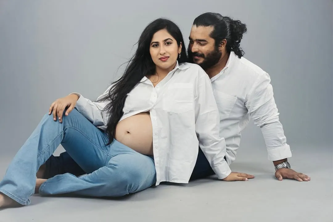 A quiet moment of connection between partners during a studio maternity photoshoot. My goal is to create a relaxed atmosphere where you can feel comfortable, resulting in timeless images that celebrate this special time.