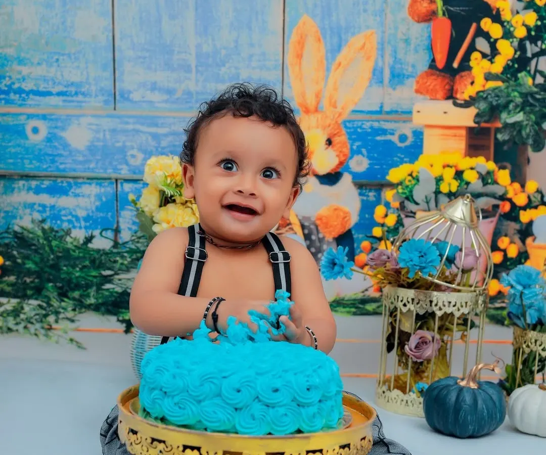 Nothing says "Happy First Birthday" like a cake smash! We love capturing the pure joy and delightful mess as your little one dives into their first cake. This is a memory full of laughter.