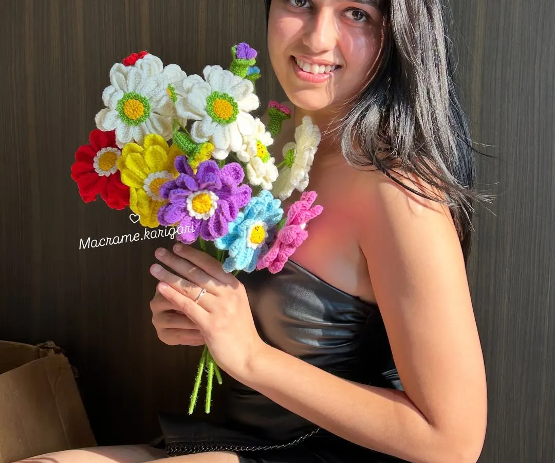 Holding a bouquet of our colorful Zianna crochet flowers always brings a smile to my face. These everlasting blooms are handmade with love and are perfect for gifting or brightening up your own space.