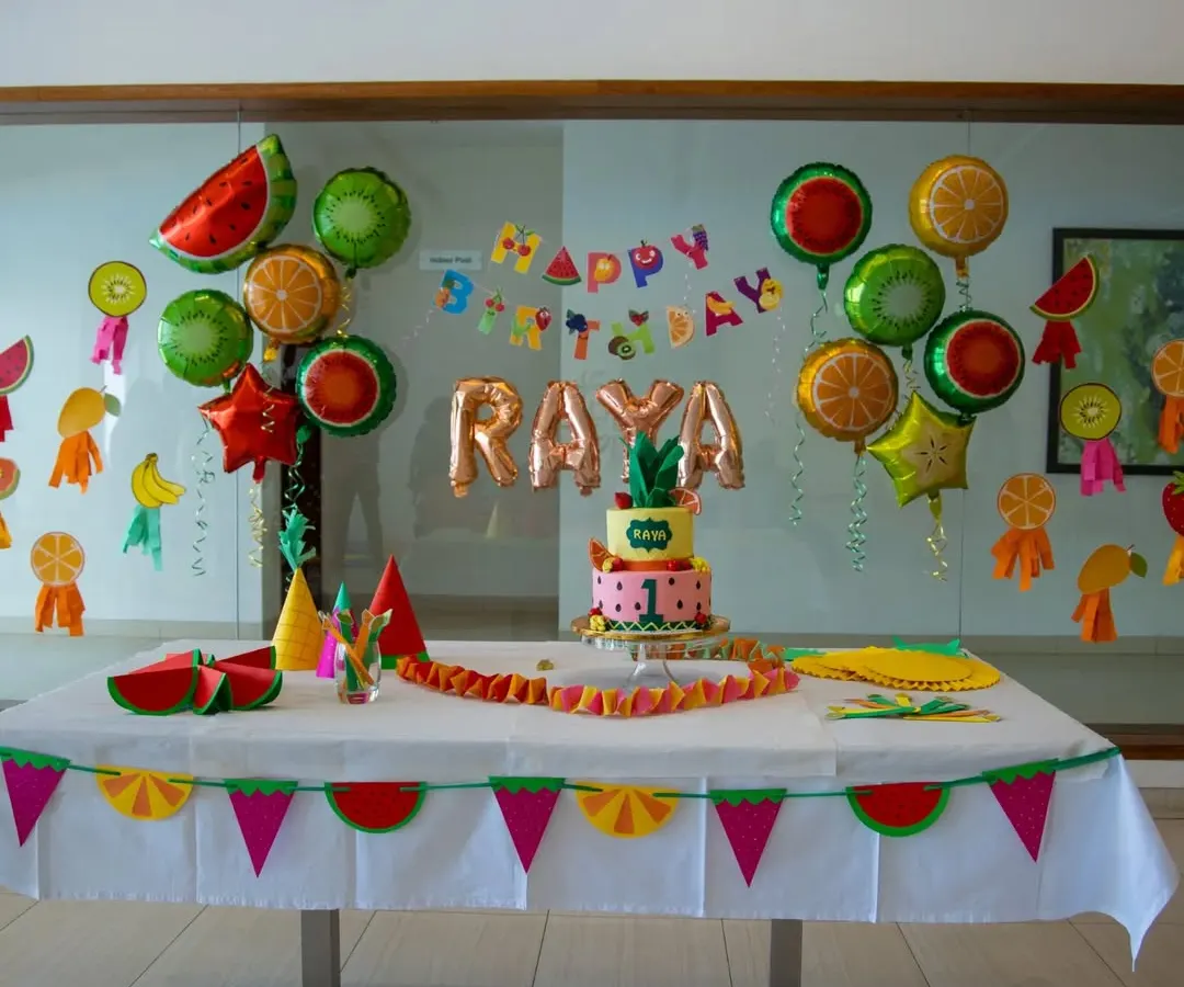 A vibrant and fun fruit-themed party setup for a first birthday. I design the entire cake table experience, including custom banners, themed balloons, and coordinated tableware to create the perfect photo opportunity.