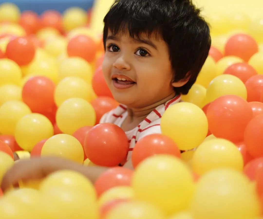 This is the look of pure, simple joy. We love seeing kids light up as they dive into our giant ball pit, a favorite spot for endless fun and making new friends.