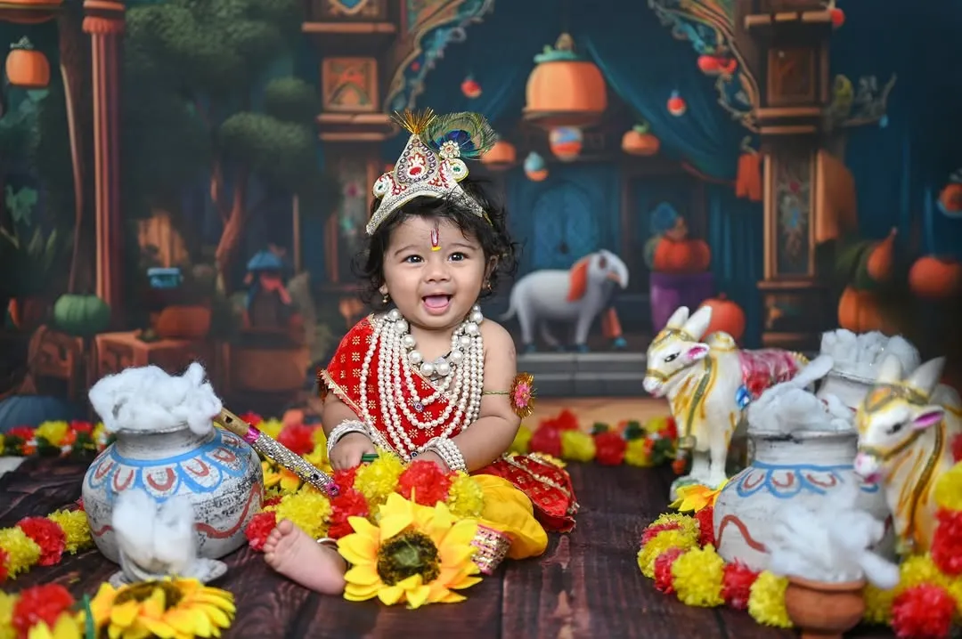 This little one dressed as Krishna is one of my most requested photoshoots. I love how the vibrant colours, detailed props, and the baby's joyful expression come together to create such a special portrait for Janmashtami.