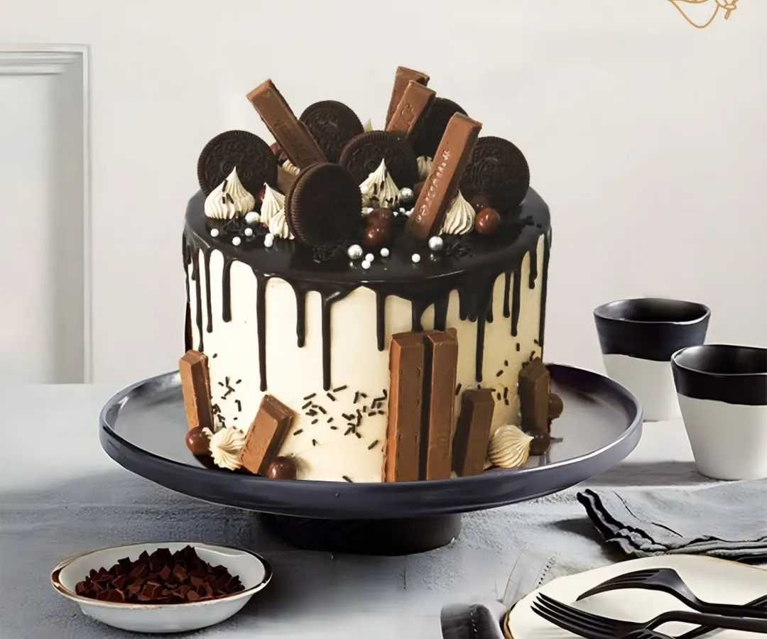 For Bhavik's celebration, I created this ultimate chocolate lover's dream. It's fully loaded with KitKats, Oreos, and a rich chocolate drip, making it a truly indulgent and unforgettable birthday cake.