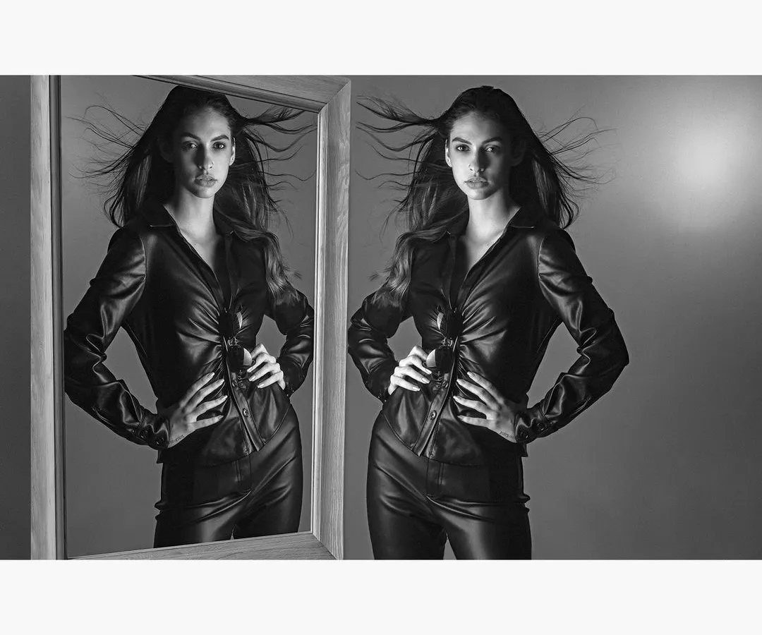 This dynamic black and white portrait uses a mirror and motion to create a sense of duality and inner strength. It is an example of the intense, fine art portraits I create for women in my studio.