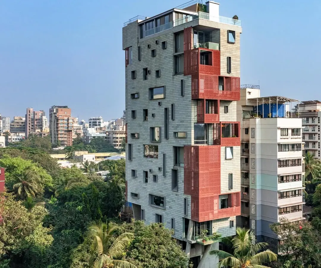 The J-House stands as a quiet counterpoint to the dense urban fabric of Mumbai. It is an exploration of vertical living that prioritizes natural light, ventilation, and a connection to the sky, using deep verandahs and screens to mediate the relationship with the city.