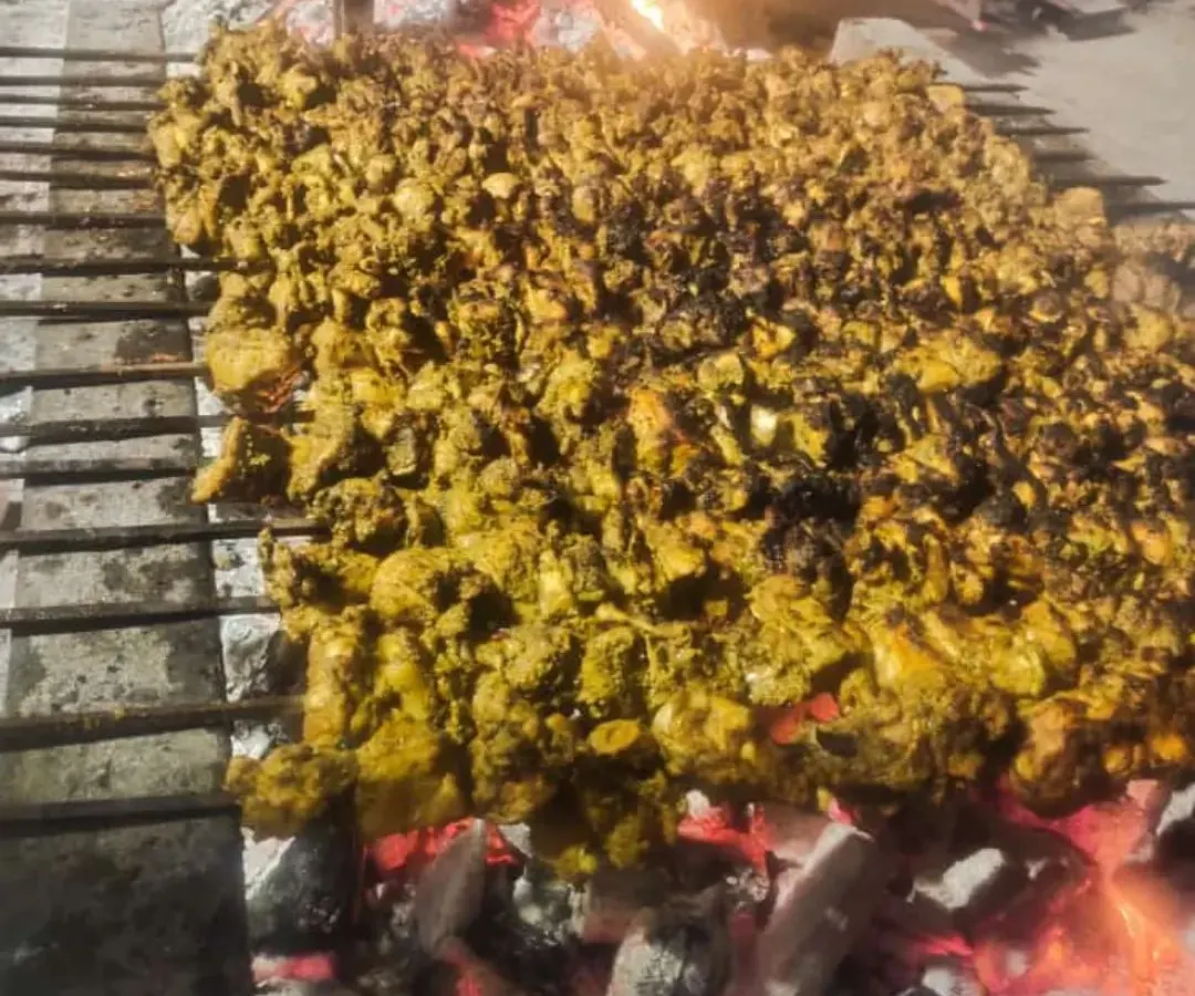 This is how we do it for big events. A huge grill full of chicken kebabs, cooked live over hot coals. The smell alone will make your guests hungry.