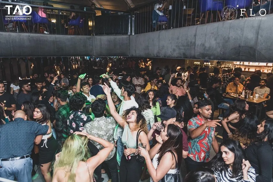 A view from my console at FLO, one of Bangalore's top clubs. I love seeing a packed, multi-level dance floor moving to the beat. This is the scale of energy I can bring to your corporate event or large party.