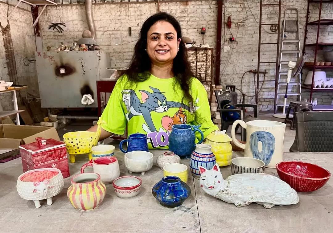 Look at that smile and the amazing collection of first-time creations! From a quirky cat sculpture to colorful mugs and bowls, this is what pure, unfiltered creativity looks like. This is what my studio is all about.