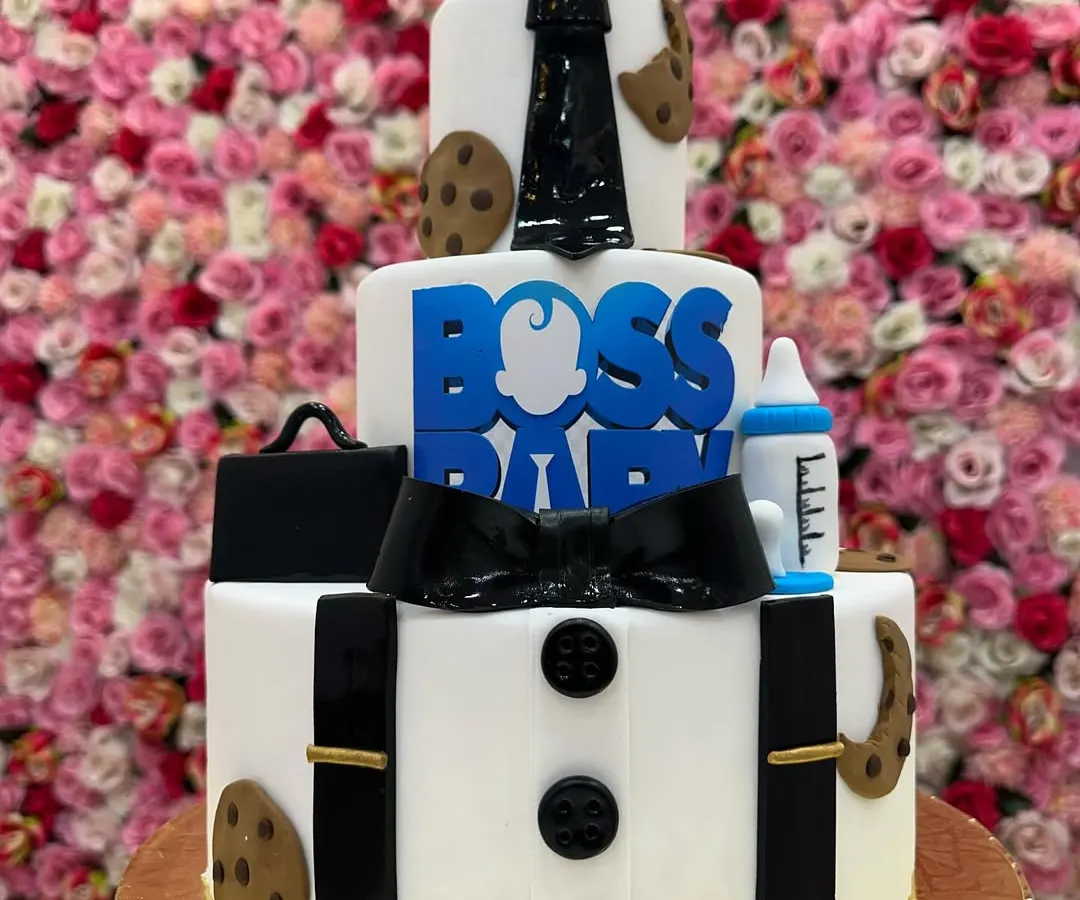 For the little boss in your life, this three-tiered Boss Baby themed cake is a showstopper. I used fondant to create sharp details like the suit, tie, and briefcase, making it a hit at kids' birthday parties.