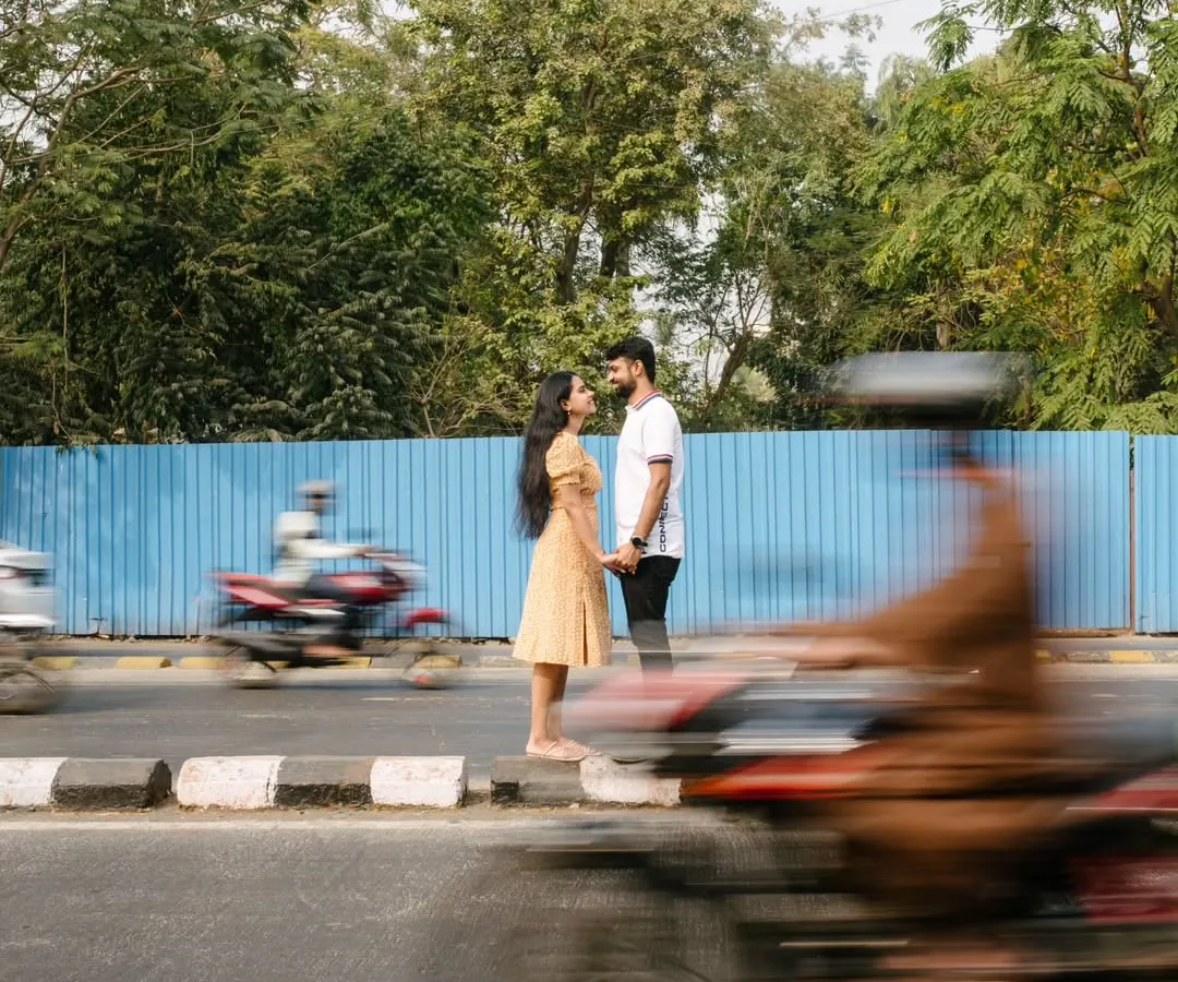 Finding stillness in the middle of the city's rush. I used a slow shutter speed here to create this motion blur effect, making the couple the calm center of their own world during this creative pre-wedding shoot in Mumbai.