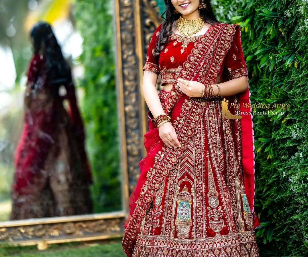 For a timeless and regal look, my red velvet lehenga is a top choice. It features intricate, heavy embroidery that looks luxurious on camera, and the rich velvet fabric adds depth and elegance. This is perfect for creating classic, heritage-themed pre-wedding portraits.
