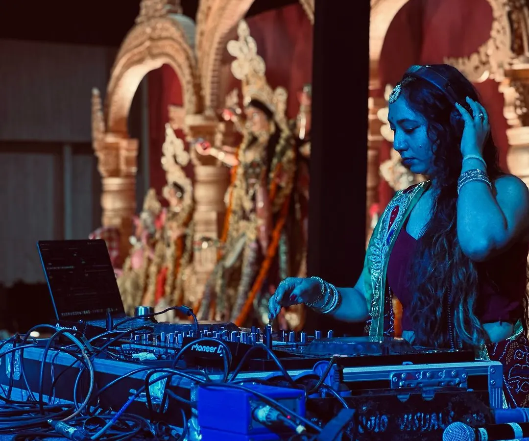 I fully immerse myself in the theme of an event. Here I am, dressed in traditional attire and lost in the music during a beautiful Durga Puja Dandiya night.