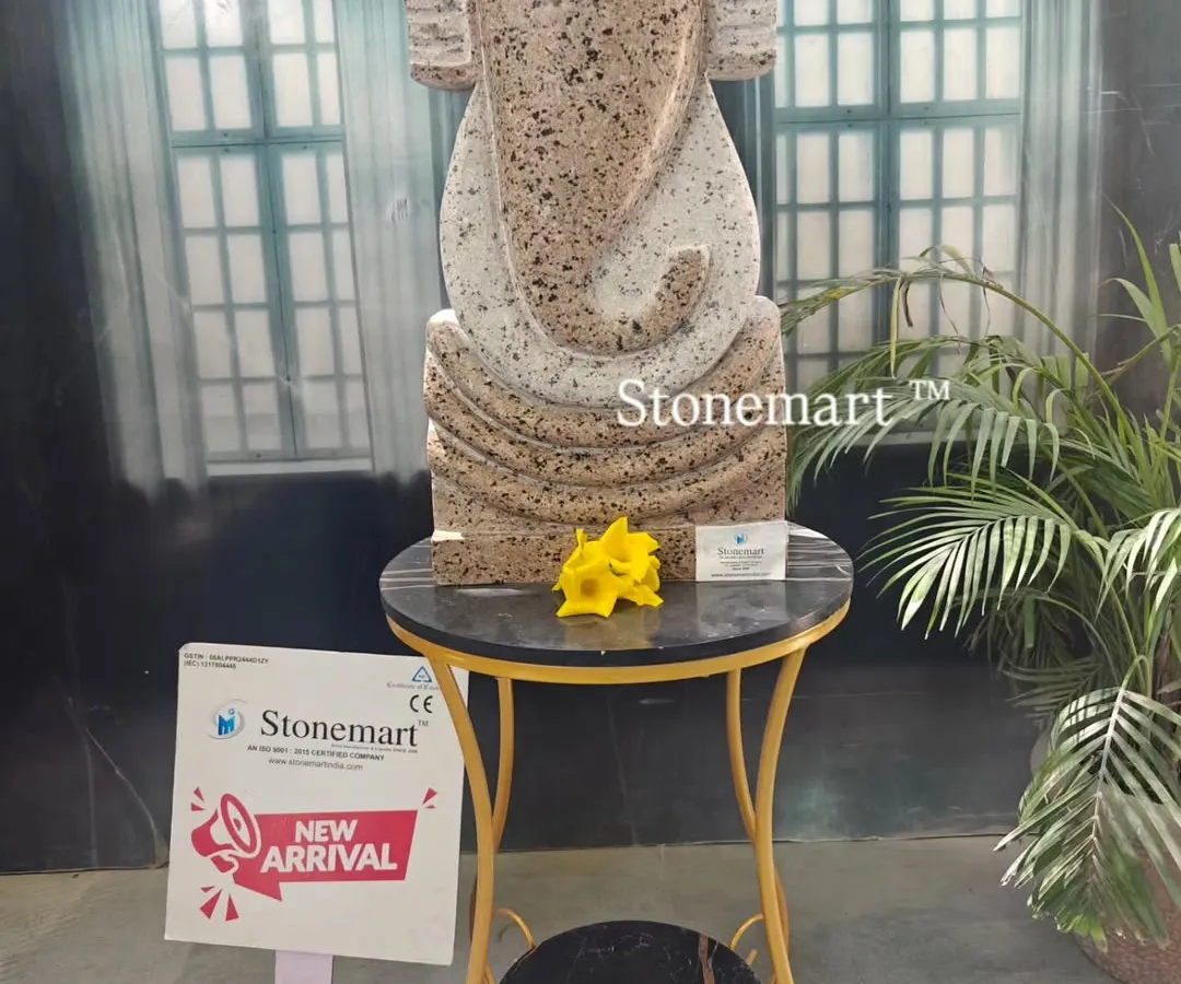This is our modern abstract Ganesha sculpture, a contemporary take on a beloved deity. Carved from granite with a unique speckled finish, this 21-inch statue serves as a distinctive art piece for modern homes, gardens, or office spaces.