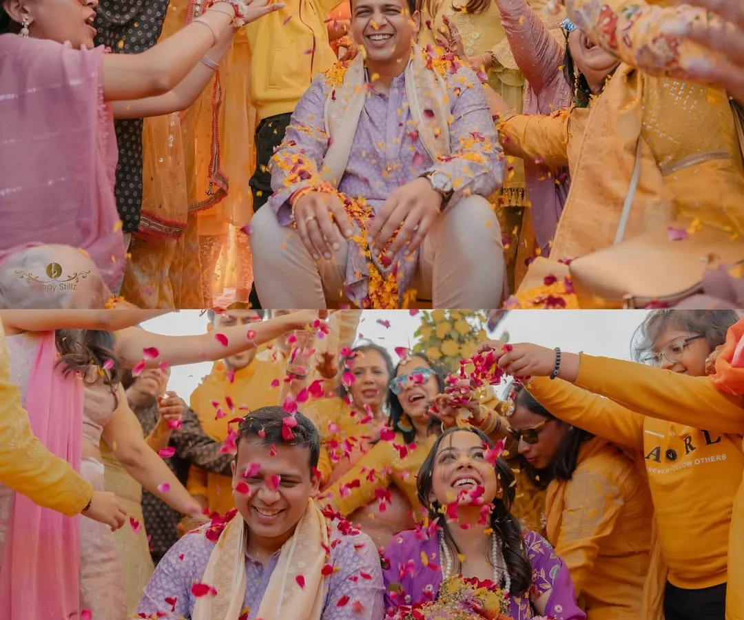 The sheer joy of a 'phoolon ki haldi' ceremony. We live for these moments of pure, uninhibited celebration, where family and friends shower the couple with love and flower petals. This vibrant image captures the energy and tradition of a pre-wedding ritual.