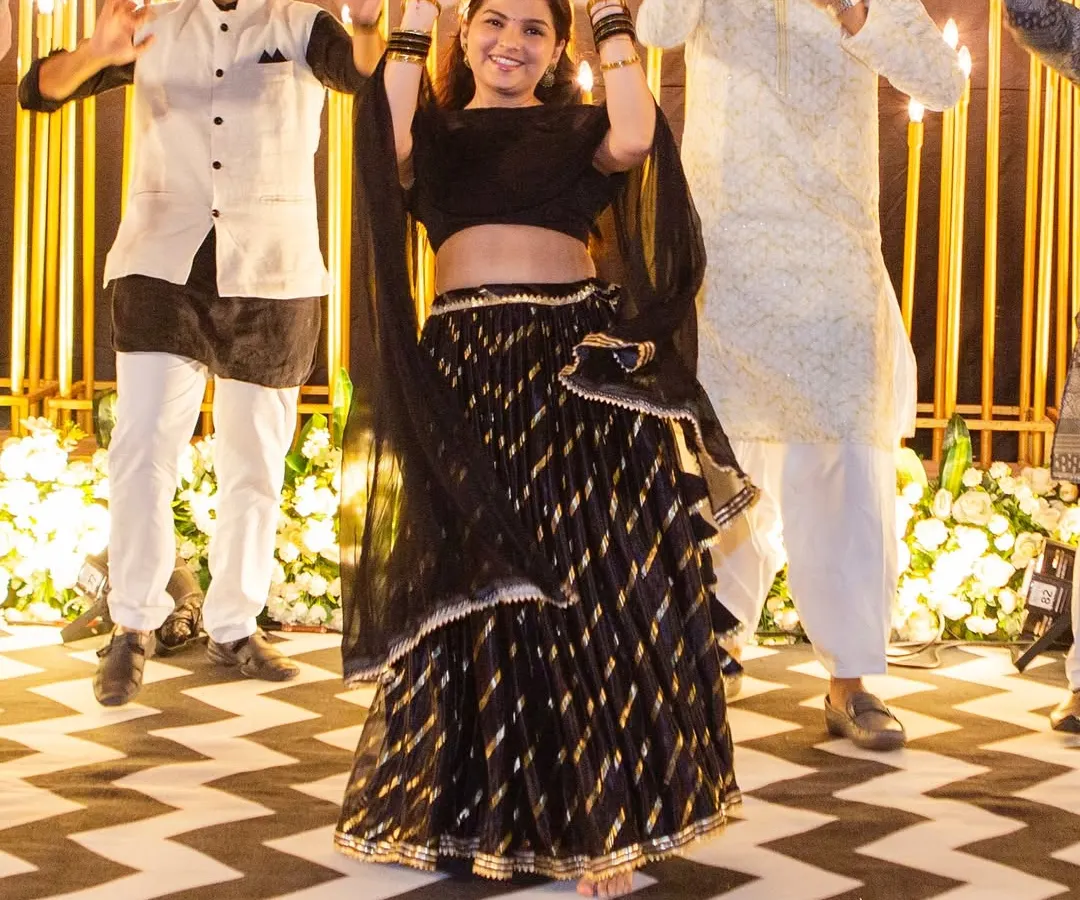 A candid shot of us leading a performance at a real sangeet night. Our goal is to make you feel so comfortable and confident that you get lost in the music and have the best time on the dance floor.