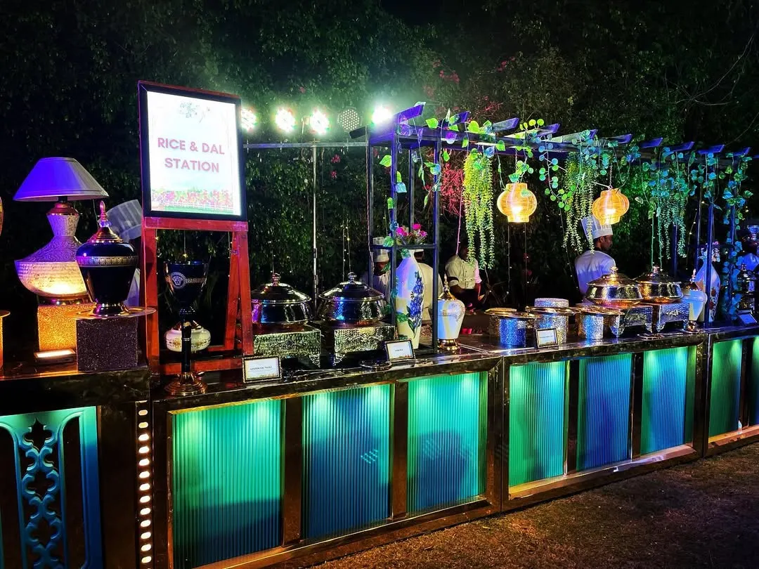 Presentation matters just as much as taste. Here is one of our beautifully arranged rice and dal stations at an event at Novotel Imagica, complete with elegant lighting and decor to match the party's theme.