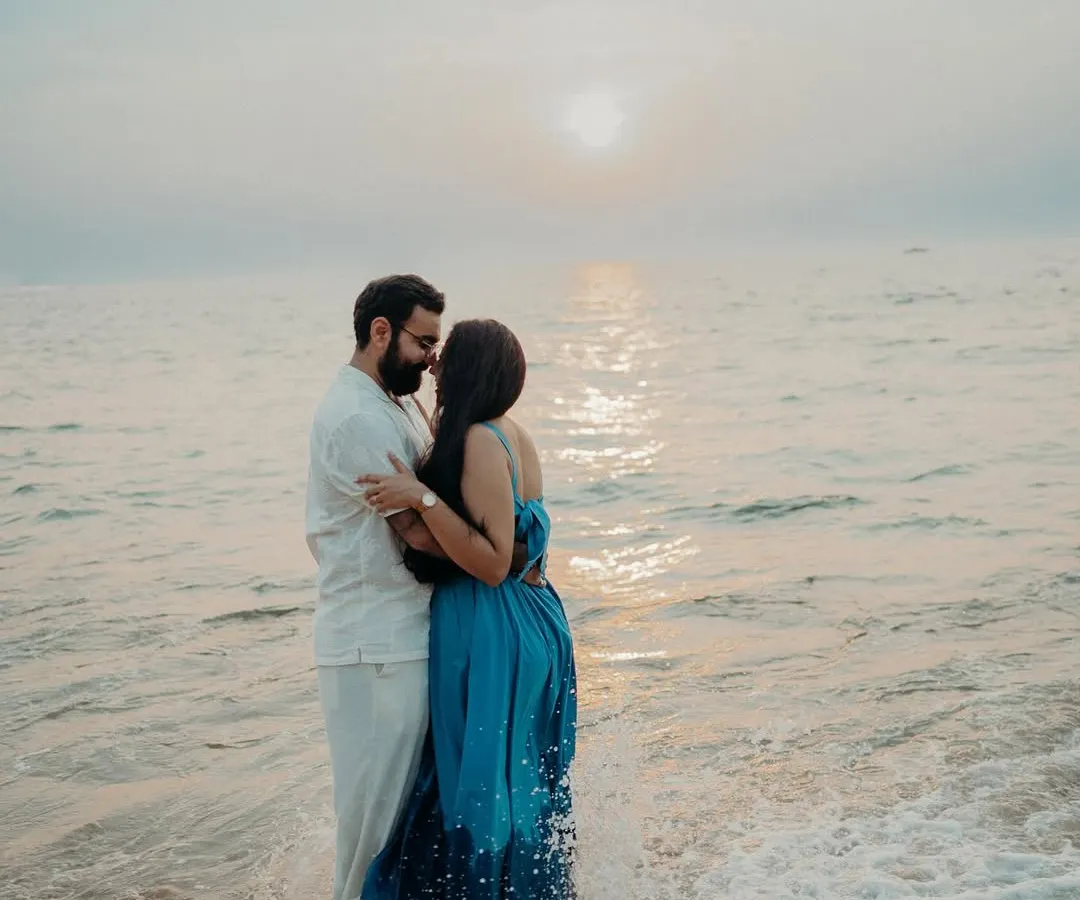 This is one of those moments that makes me love what I do. Just before sunset in Goa, with the waves washing over them, this sweet couple was completely lost in their own world. My documentary approach means I wait for these real, unscripted connections to happen, creating a timeless memory of their love during this natural light couple shoot.