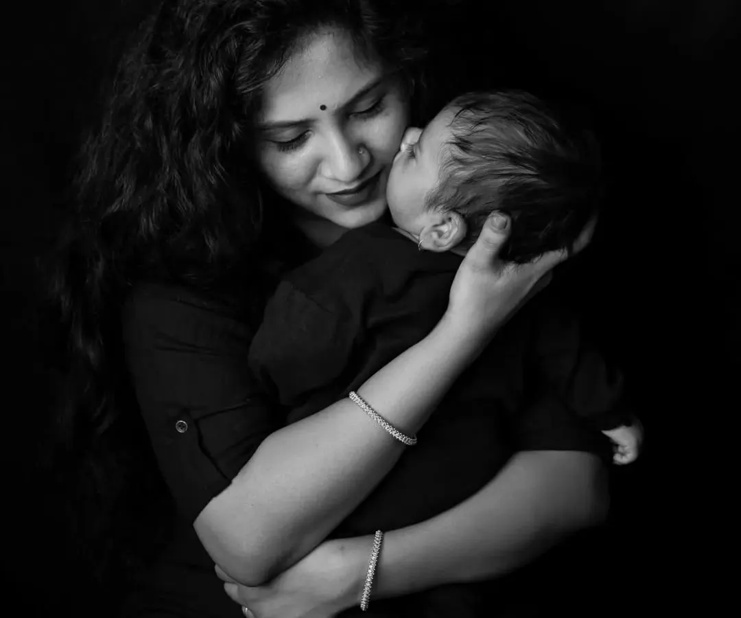 There is a special kind of quiet in moments like these. This black and white portrait captures the pure, unconditional love in a mother's gentle kiss. My goal is always to create timeless images that let the emotion speak for itself.