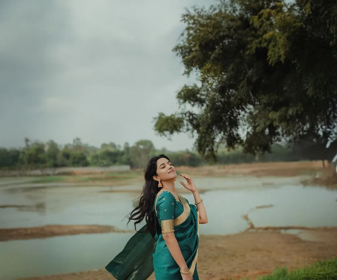 A beautiful moment captured during a shoot with the lovely actress Mirnalini Ravi. I created a soft, natural look that enhanced her features and complemented the serene outdoor setting, showing my skill in makeup for professional photography.