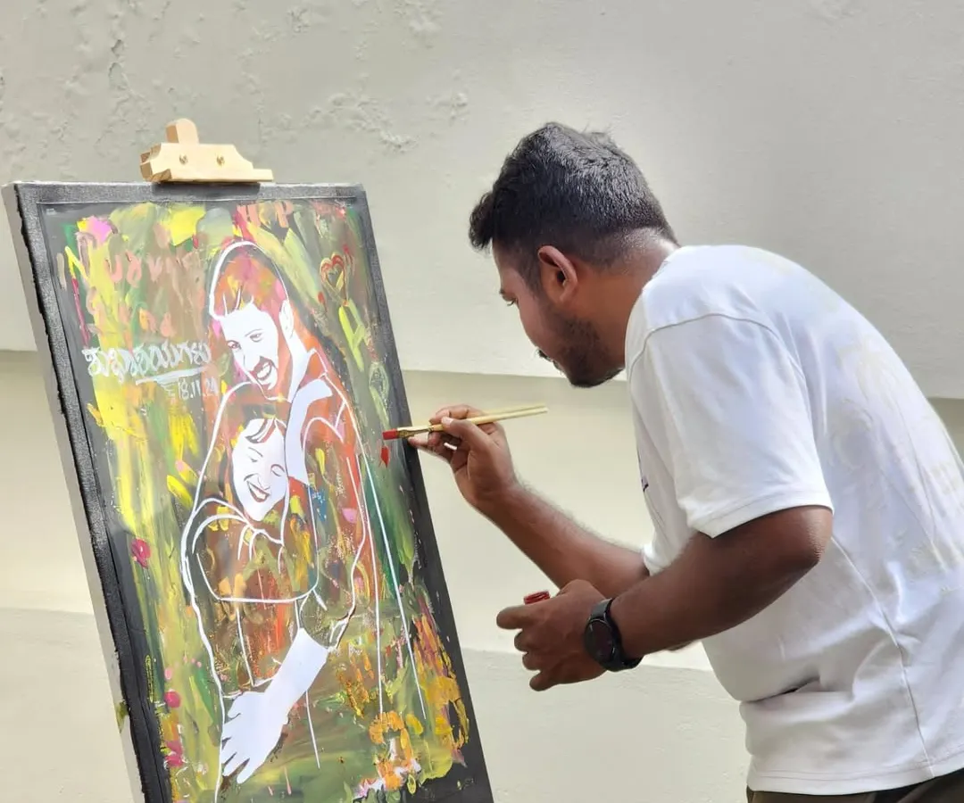 Here I am in my element, capturing the energy of the event. I paint live on-site, translating the sounds, colors, and emotions of the moment directly onto the canvas with each brushstroke.