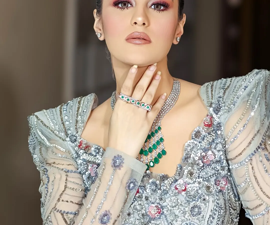 Your bridal look isn't complete without the right bangles. This shot focuses on a pair of beautiful, ornate gold kadas, capturing their detailed texture and craftsmanship, a perfect memory for your wedding album.