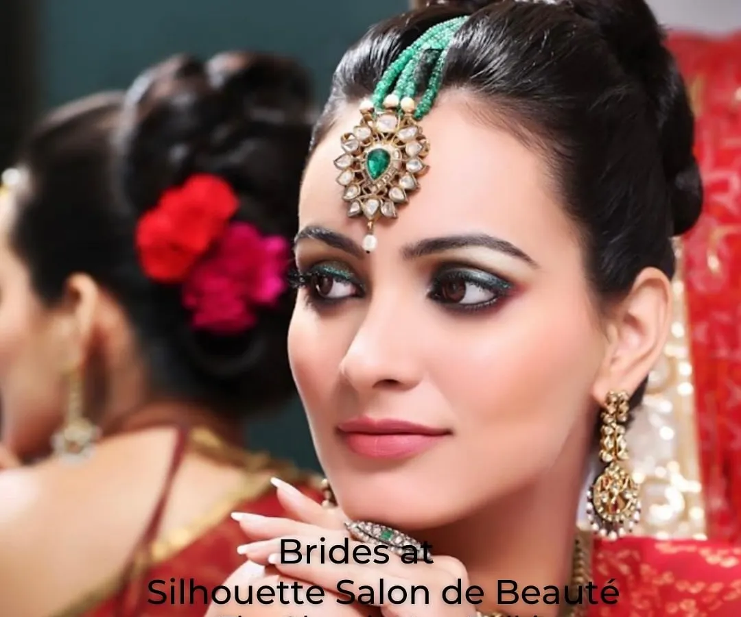 We believe bridal makeup is a timeless art. This exquisite look features dramatic, emerald-green smokey eyes, flawless skin, and a traditional maang tikka, reflecting a perfect blend of classic elegance and modern sophistication for your most important day.