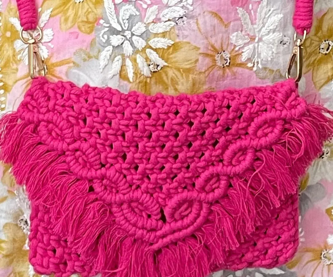 I just love this hot pink sling bag! The color is so vibrant and happy. It has a beautiful V-flap design with fringes and a sturdy braided strap, making it a perfect statement piece for any outfit.