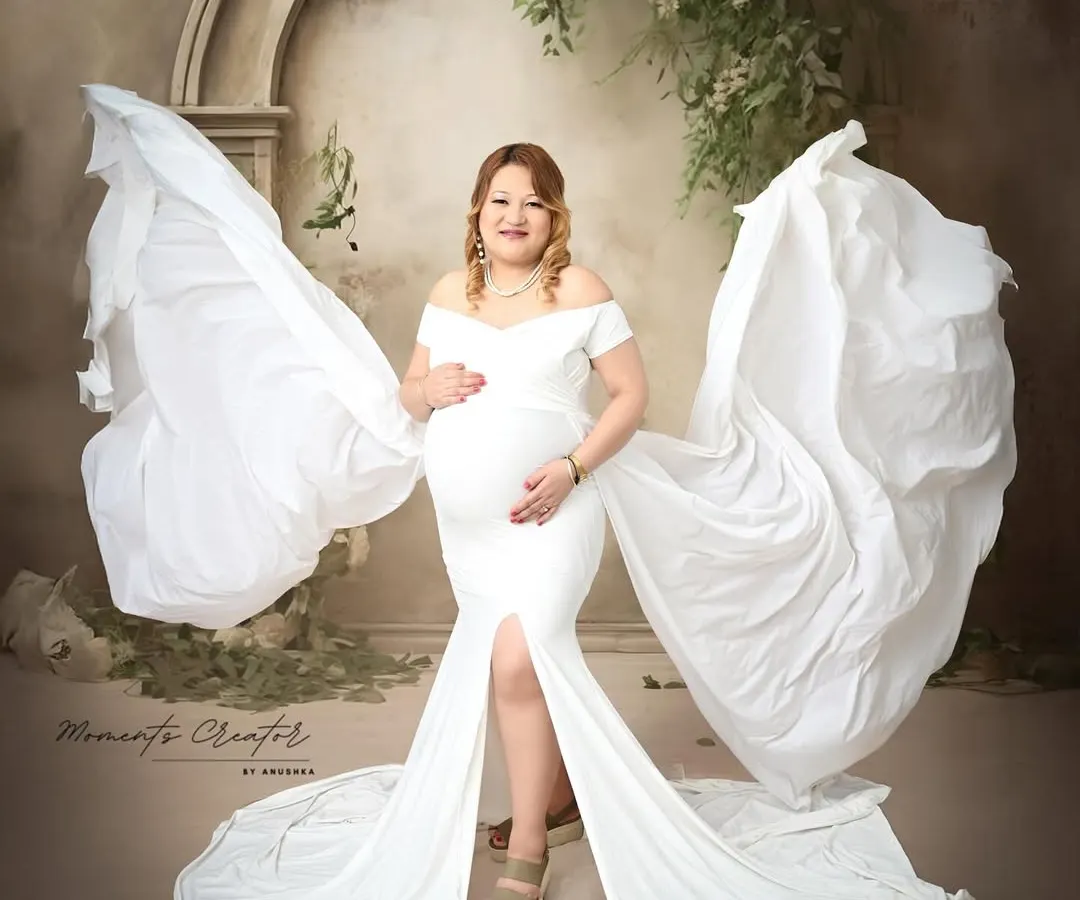 A truly angelic moment. I use flowing fabrics and dramatic poses to create ethereal solo portraits that celebrate the power and beauty of the expecting mother.