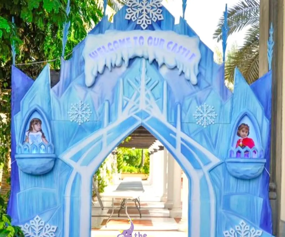 Guests were welcomed to Arendelle through this magnificent ice castle entrance. We designed this custom structure for a Frozen-themed party to create an immersive experience from the very first moment, complete with snowflake details and character cutouts.