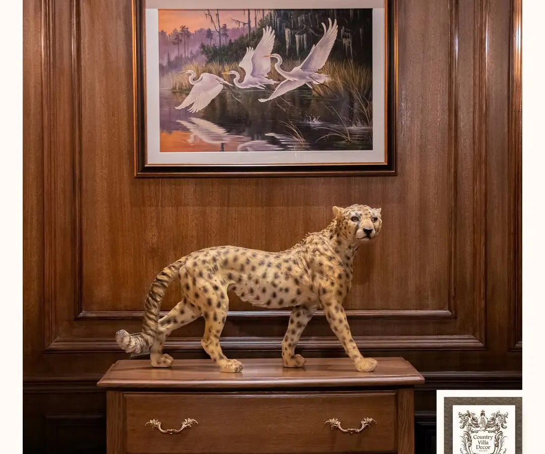I believe decor should be bold and tell a story. This handcrafted cheetah sculpture, placed on a vintage chest, creates a powerful focal point that blends wild elegance with classic charm. It’s a perfect example of how I mix themes to create a unique interior vibe.