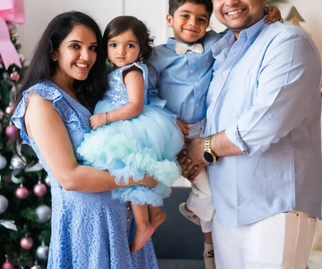 The greatest reward for me is when clients become like family. I first met this wonderful couple for their engagement shoot, and it has been a privilege to document their journey through their wedding and now as a beautiful family of four. This festive studio session captures the pure joy of their growing family.