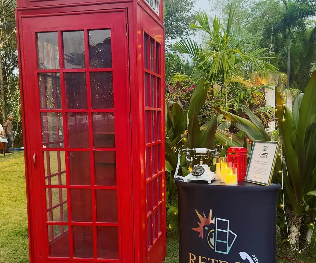 My classic red British-style phone booth is always a hit. This complete setup includes the iconic booth, a separate podium, and a vintage phone, creating a fun, nostalgic experience for your guests at any wedding or party.