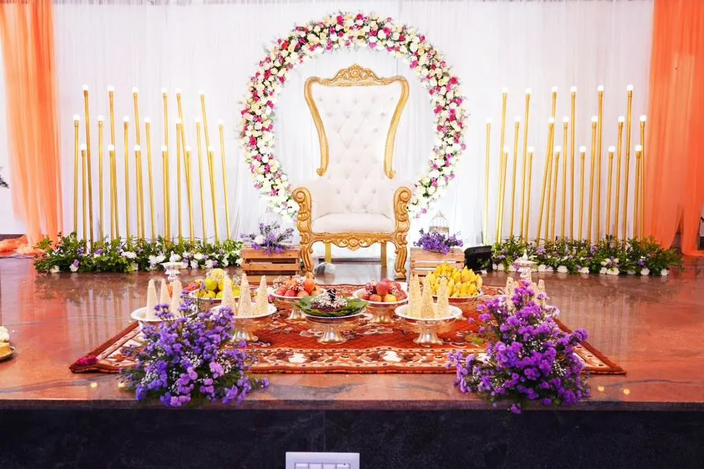 For this baby shower, we designed an elegant and serene stage with a throne for the mother-to-be. The floral ring and candle-lit backdrop created a warm, celebratory atmosphere, perfect for welcoming a new life.