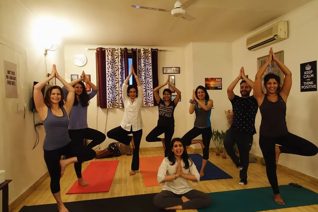 The beautiful energy of a group class at my Delhi studio. Here we are practicing Vrikshasana, the tree pose, finding balance and strength together as a community.