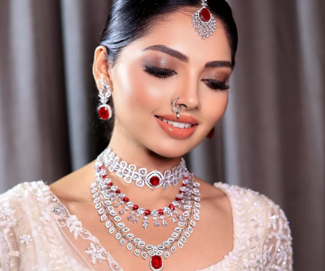 This is the essence of my signature bridal glam. The focus is on creating a flawless, radiant complexion with soft, defined eyes and lips that enhance the bride's natural beauty, ensuring she looks timeless in her wedding photos.