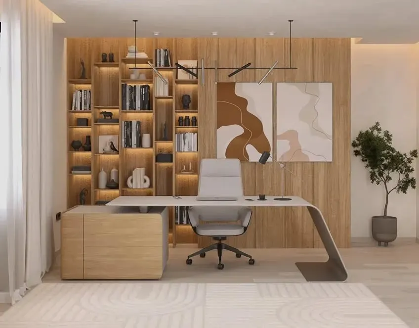 An executive office should be both functional and inspiring. We created this workspace with a custom wrap-around desk, floor-to-ceiling backlit shelving for storage and display, and a warm wood-paneled wall that exudes professionalism and style.