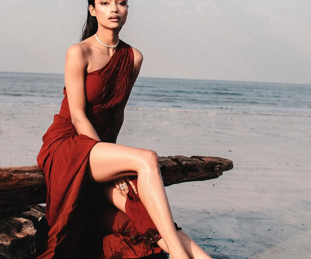 A closer look at the elegant draping and rich color of this one-shoulder evening dress. The design is both modern and timeless, ensuring you look and feel incredible for your special occasion. Renting this piece means you get all the glamour without the commitment.