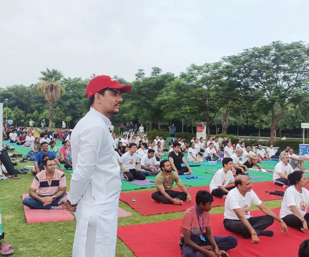 I have experience leading large scale wellness events for corporations and communities. Here, I am guiding a large group through a morning yoga session, creating a shared sense of peace and energy that participants carry with them throughout their day.
